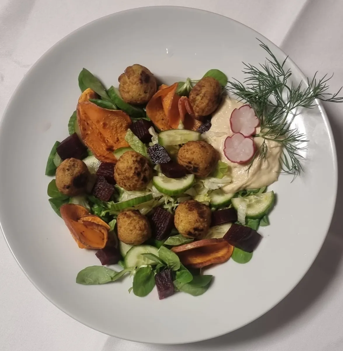 Falafel salad with sweet potato, beetroot, cucumber, hummus and dill